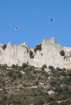 Paragliders over Peyrepeteuse